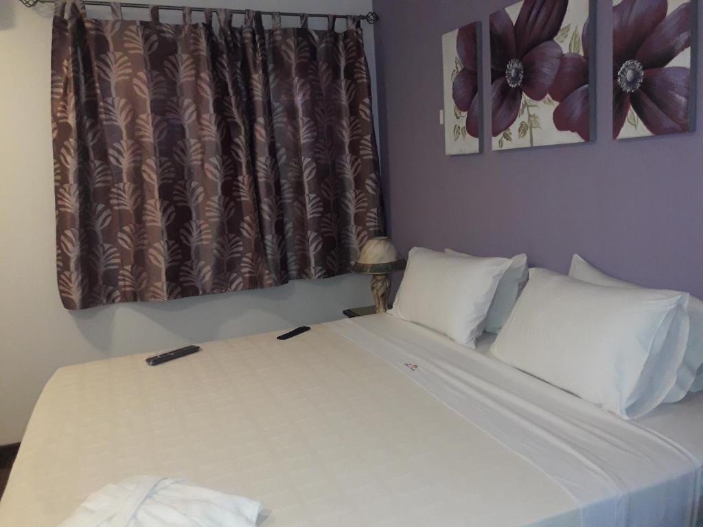 Postel nebo postele na pokoji v ubytování Hotel Casa Jardin