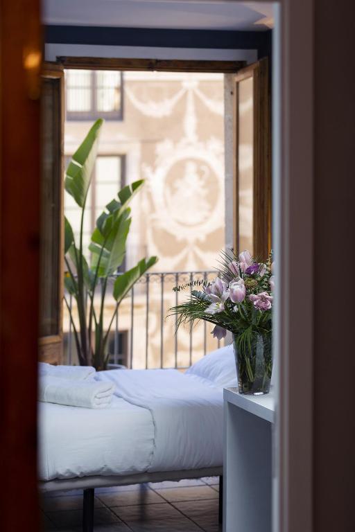 Postel nebo postele na pokoji v ubytování Hostal Sol y K