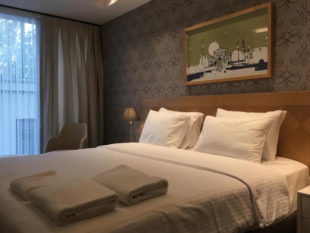 Postel nebo postele na pokoji v ubytování Four-G Hotel