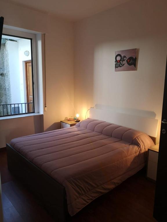 A bed or beds in a room at Sollevante Guest House