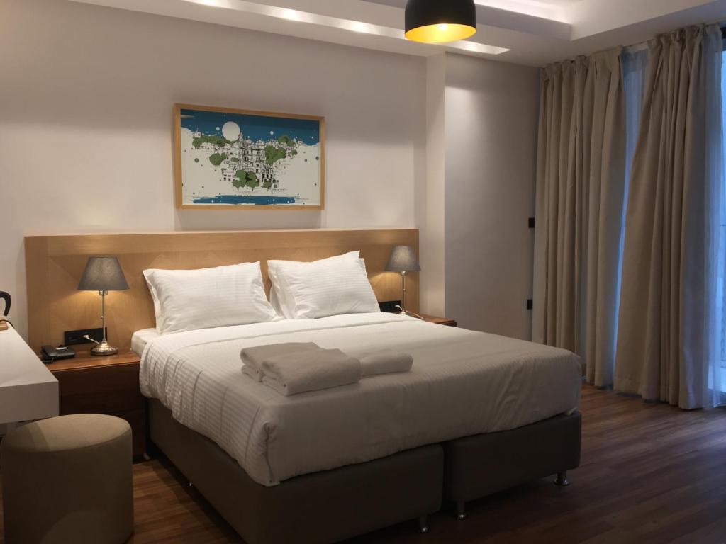 Postel nebo postele na pokoji v ubytování Four-G Hotel