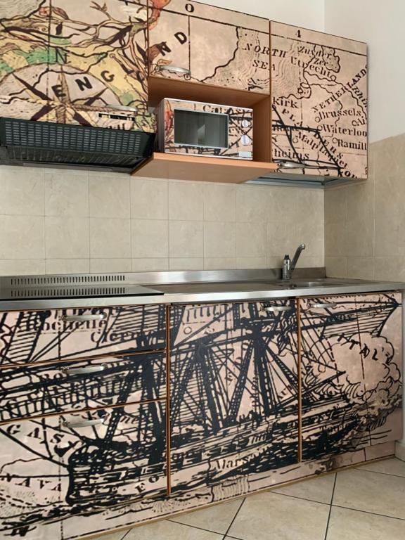 A kitchen or kitchenette at Hotel Residence Veliero
