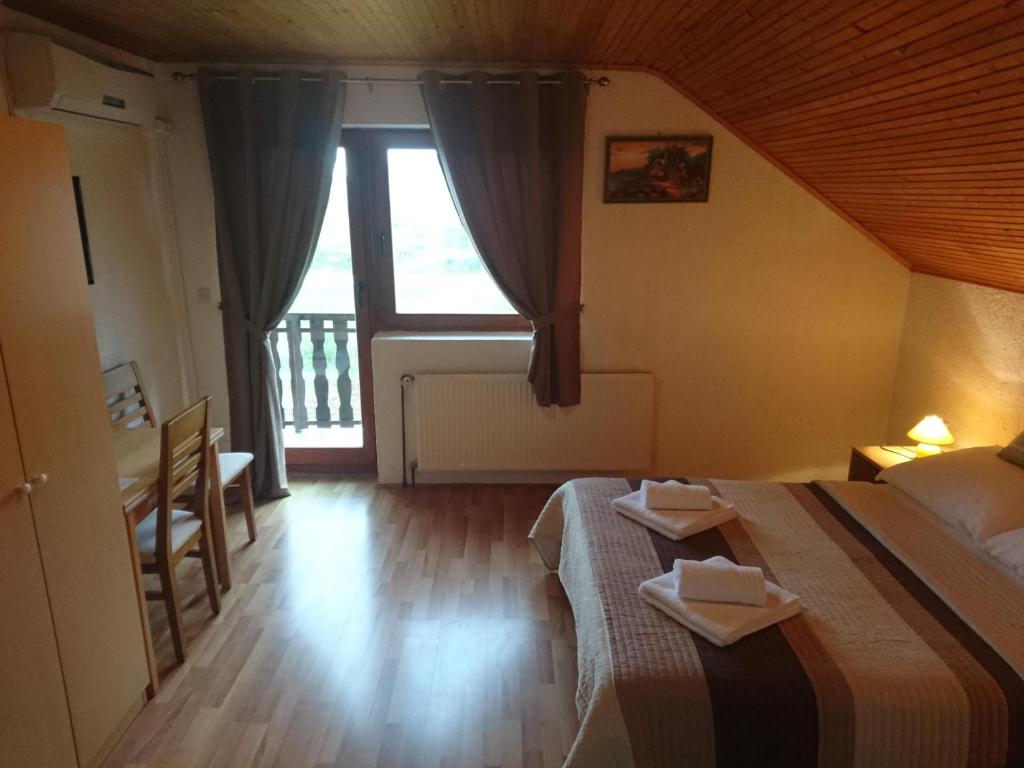 Postel nebo postele na pokoji v ubytování House Viktoria