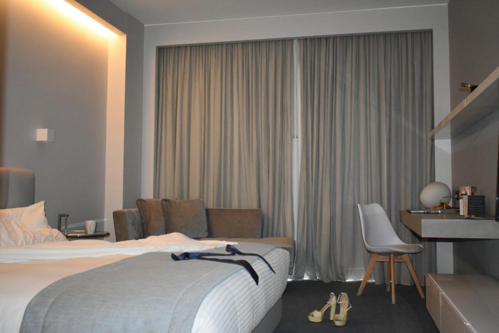 Postel nebo postele na pokoji v ubytování ParkTower Suites