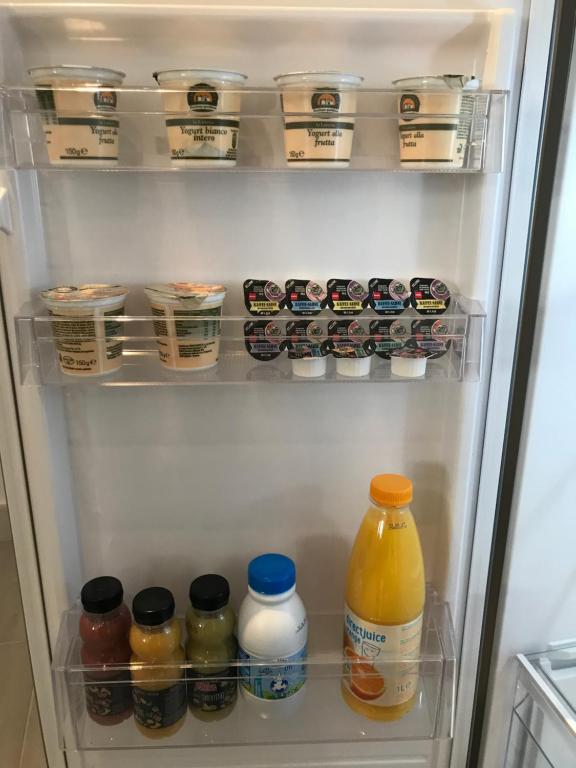 an open refrigerator filled with lots of food and drinks at Bari Lory’s Home in Bari