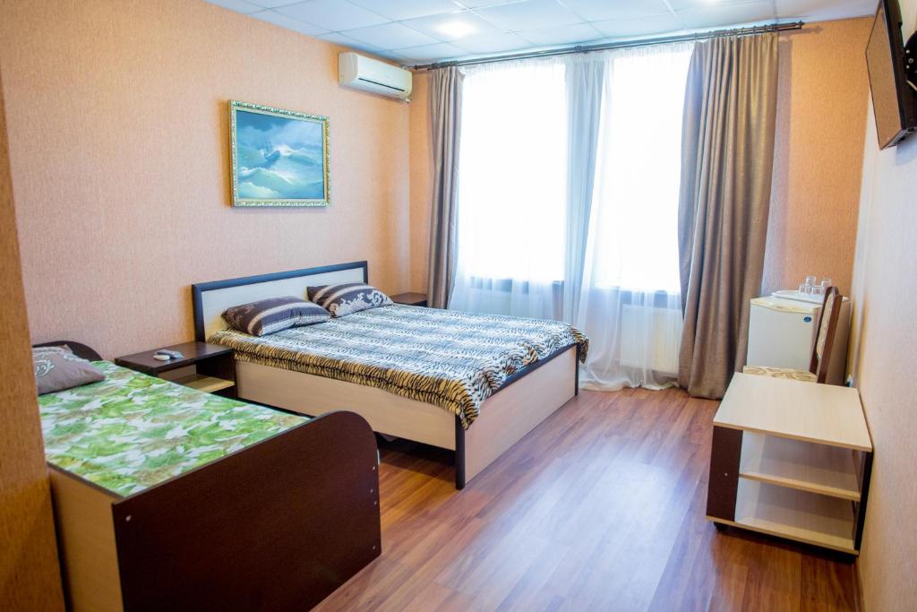 Postel nebo postele na pokoji v ubytování Art Hotel
