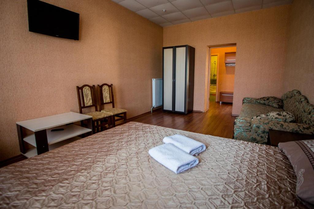 Postel nebo postele na pokoji v ubytování Art Hotel