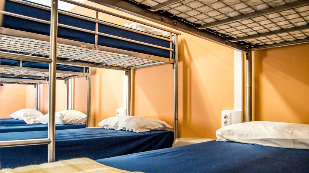 Postel nebo postele na pokoji v ubytování Hostel Santa Monaca