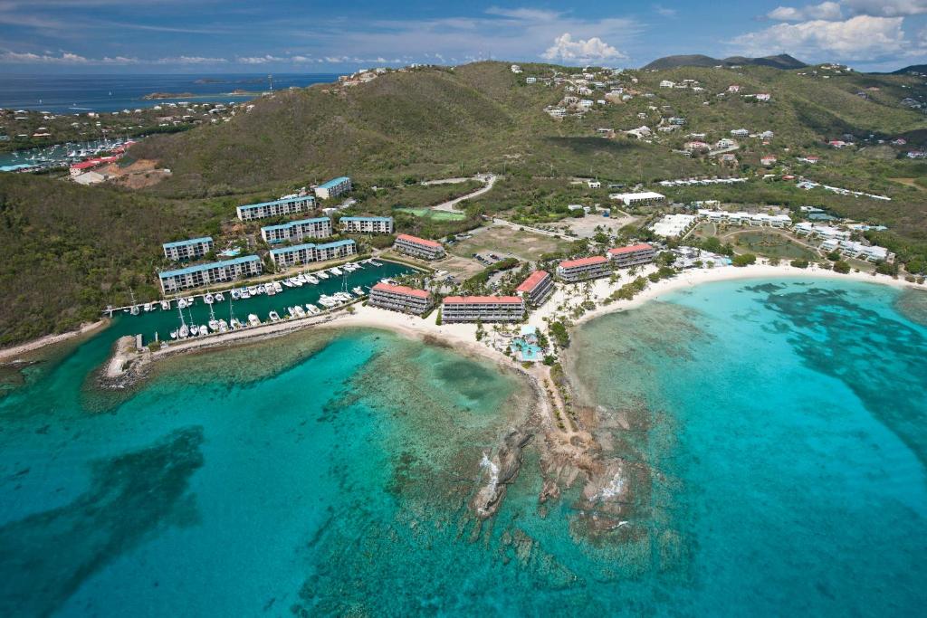 an aerial view of a resort on a beach at Beachfront At Crystal Cove in East End