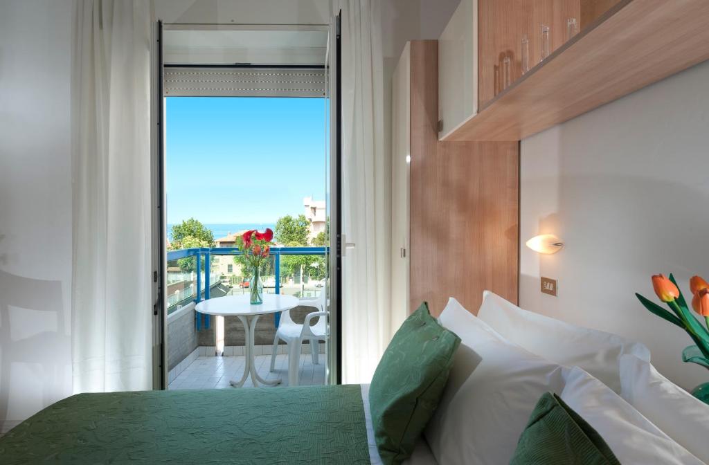 Un pat sau paturi într-o cameră la Hotel Felix