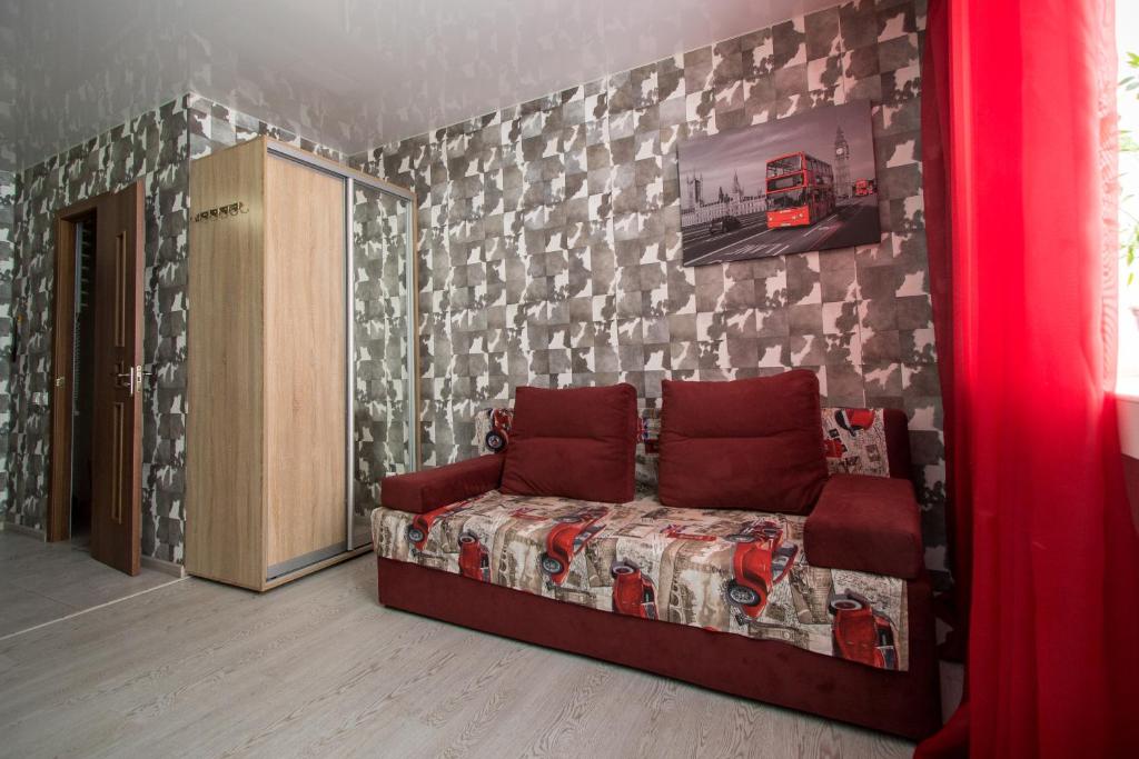a bedroom with a bed and a wall with at Апартаменты-студия на пр Науки,Мечникова in Dnipro