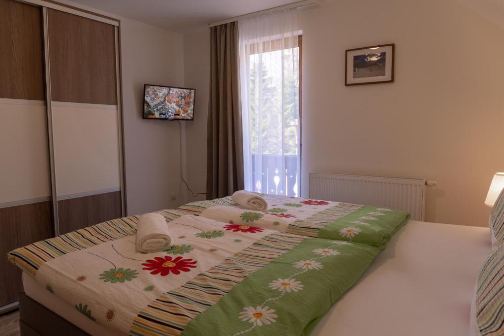 Postel nebo postele na pokoji v ubytování pension George