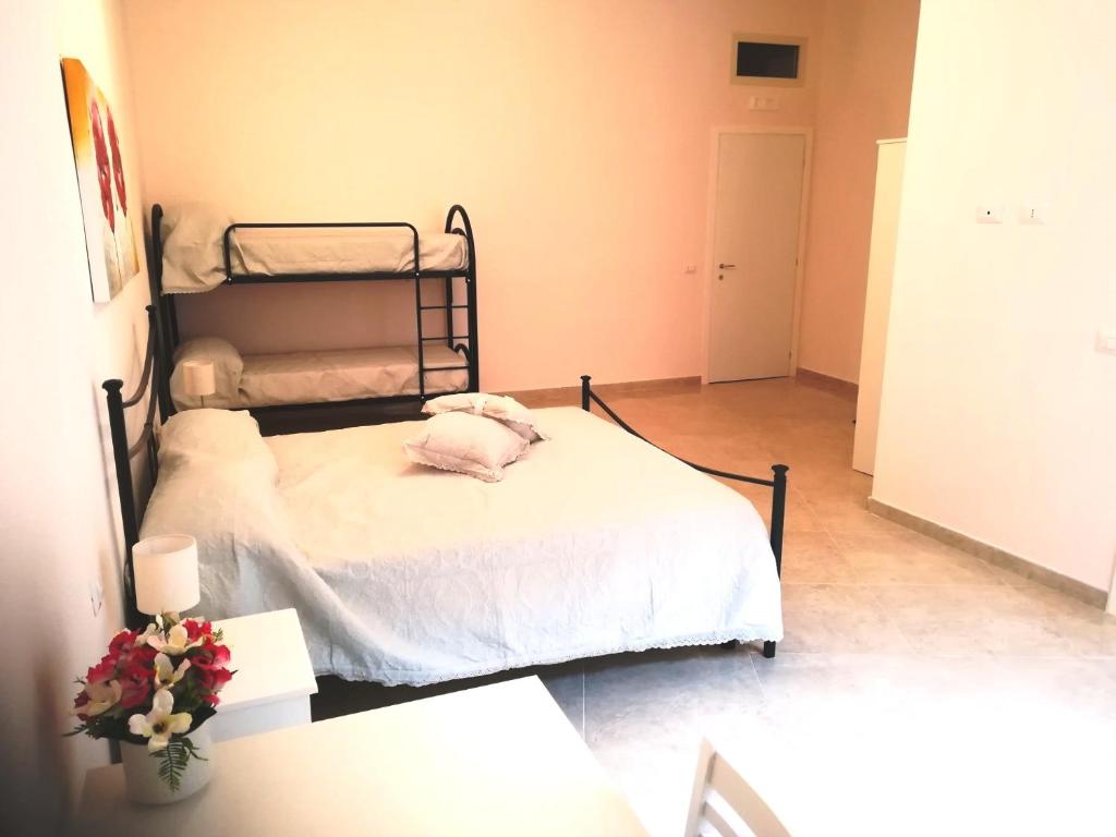 Łóżko lub łóżka w pokoju w obiekcie Domusrealstella
