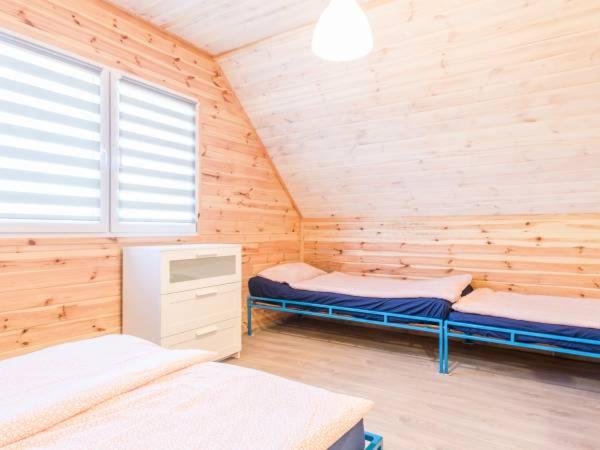 Postel nebo postele na pokoji v ubytování Domki Anchor