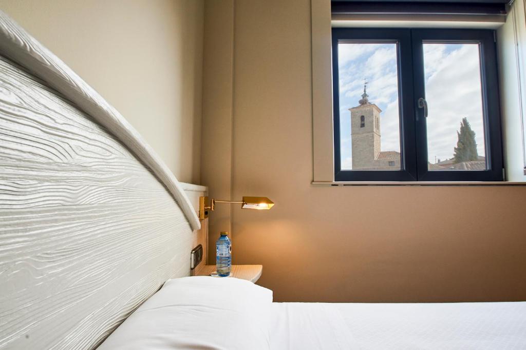 A bed or beds in a room at Sotopalacio HSR