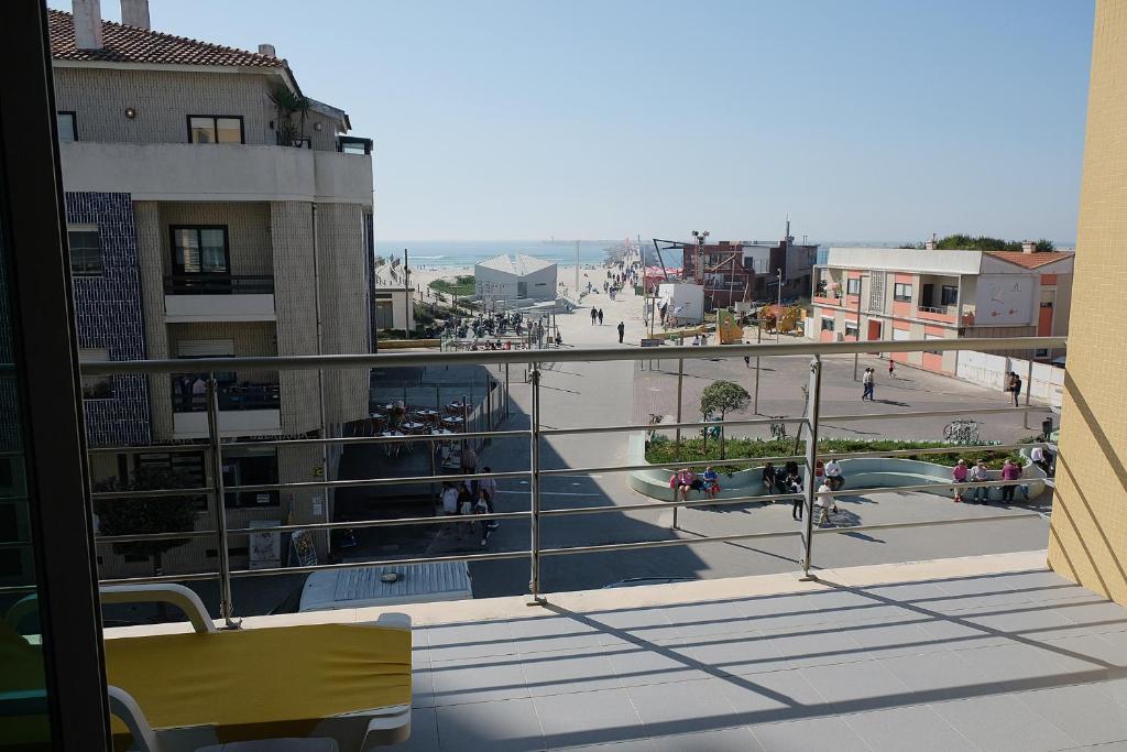 a view of a city from a balcony at Marisol Ocean View in Praia da Barra