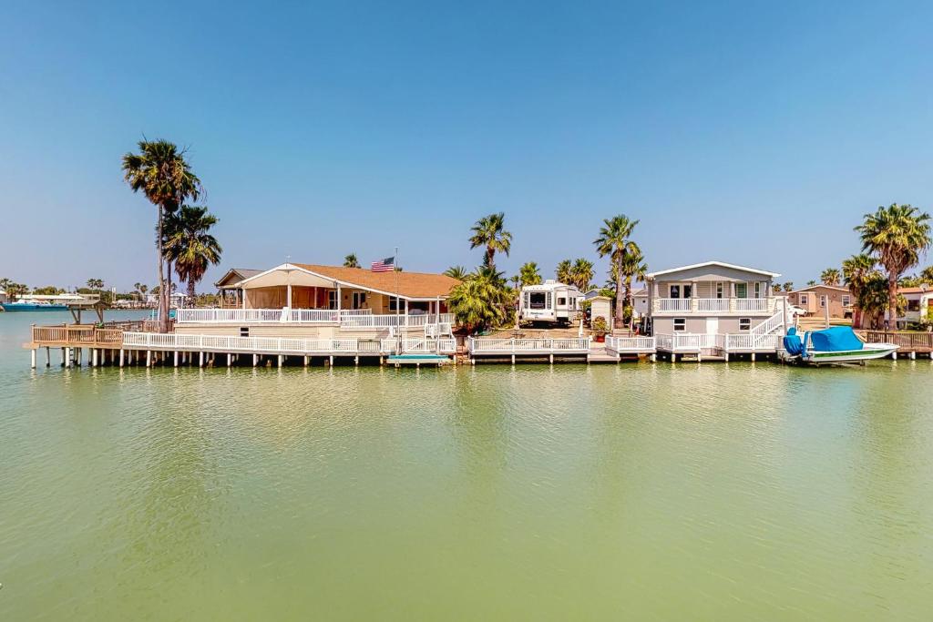 a group of houses on a dock on a body of water at Long Island Village Unit 347 in Port Isabel