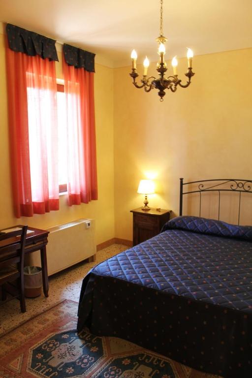 Postel nebo postele na pokoji v ubytování Villa Rinalducci