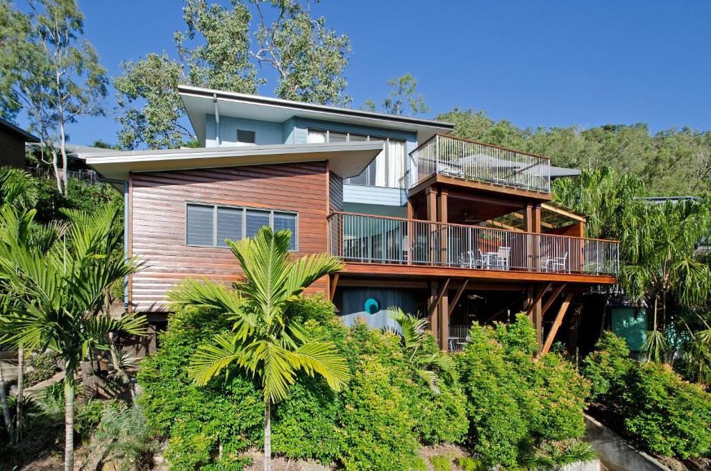 a house on the hill with trees at Nautilus on Hamilton Island by HIHA in Hamilton Island