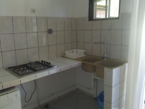 Una cocina o zona de cocina en Logement B