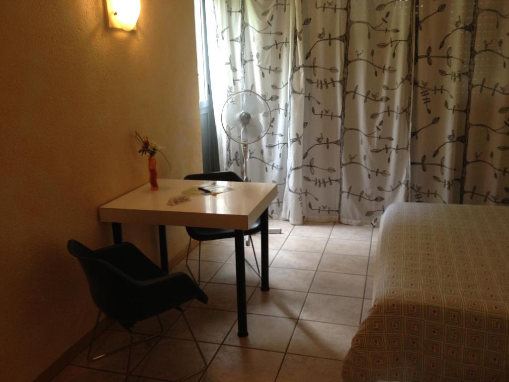 Postel nebo postele na pokoji v ubytování Residence Tell