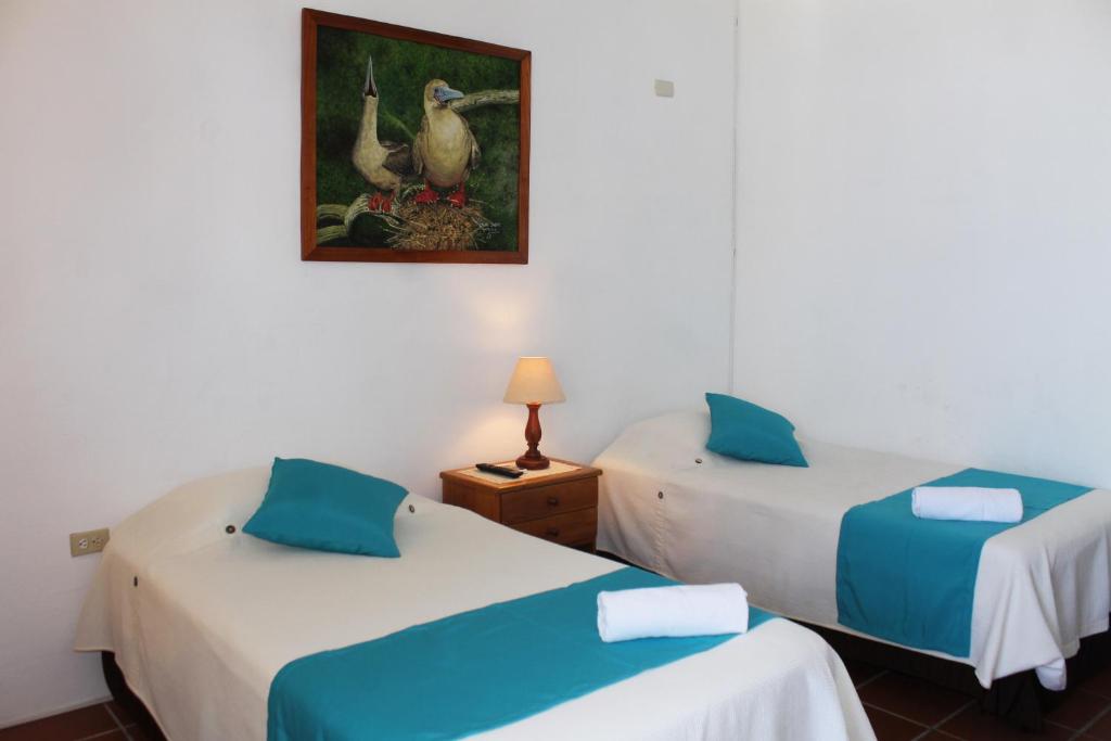 Postel nebo postele na pokoji v ubytování Posada del Mar