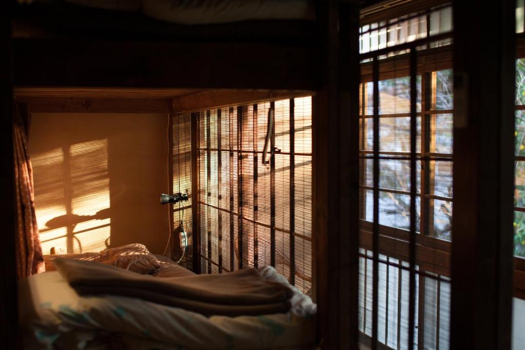 Postel nebo postele na pokoji v ubytování Guesthouse toco