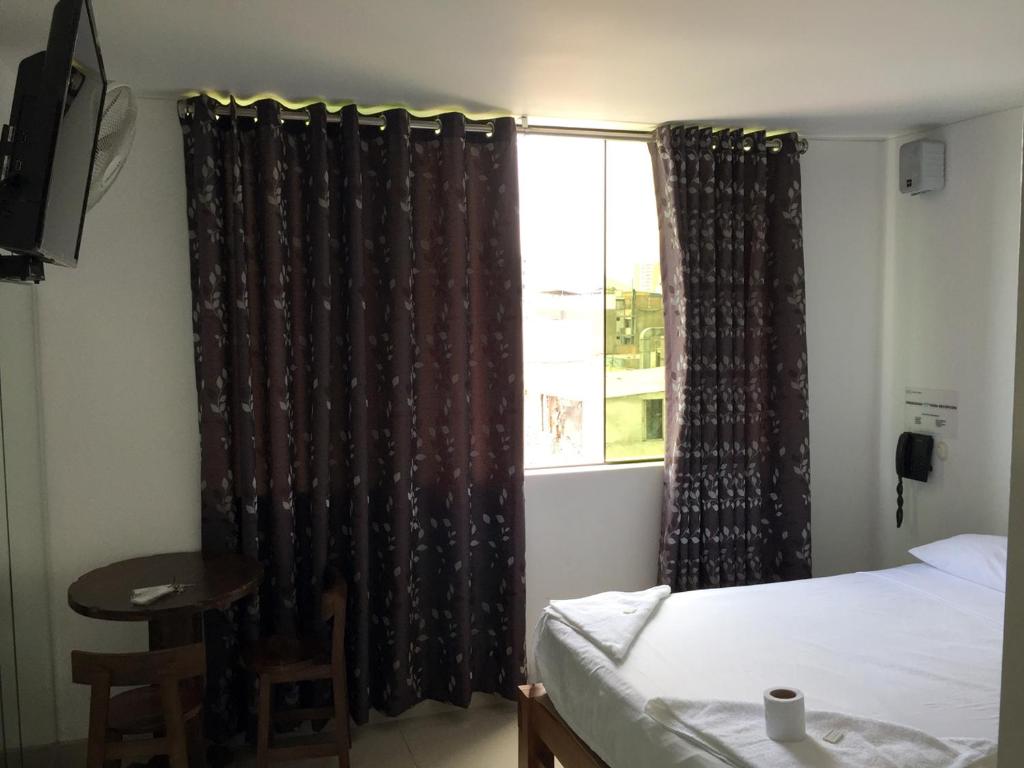 Postel nebo postele na pokoji v ubytování Hostal Sueños