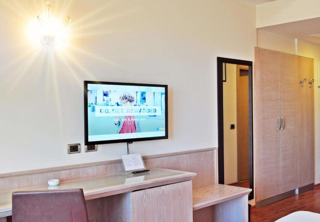 TV a/nebo společenská místnost v ubytování San Giorgio, Sure Hotel Collection by Best Western