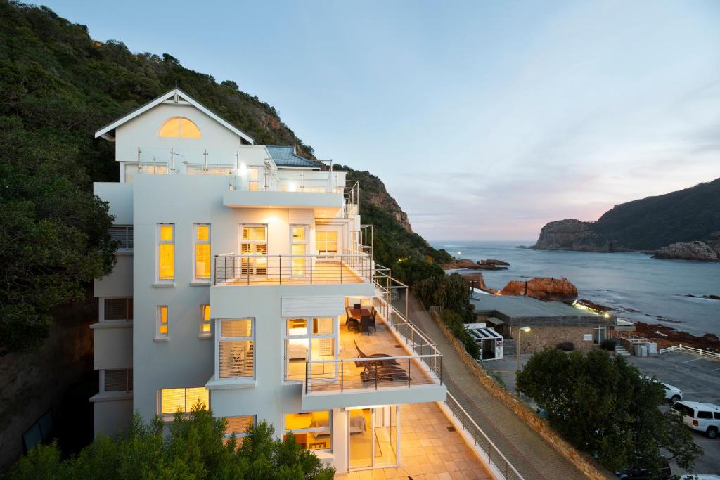 
a large house with a view of the ocean at Beacon House in Knysna
