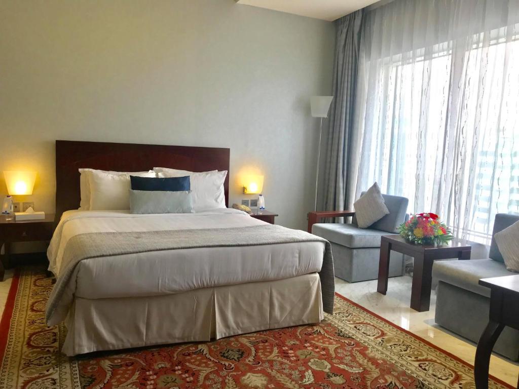 Postel nebo postele na pokoji v ubytování Samaya Hotel Deira