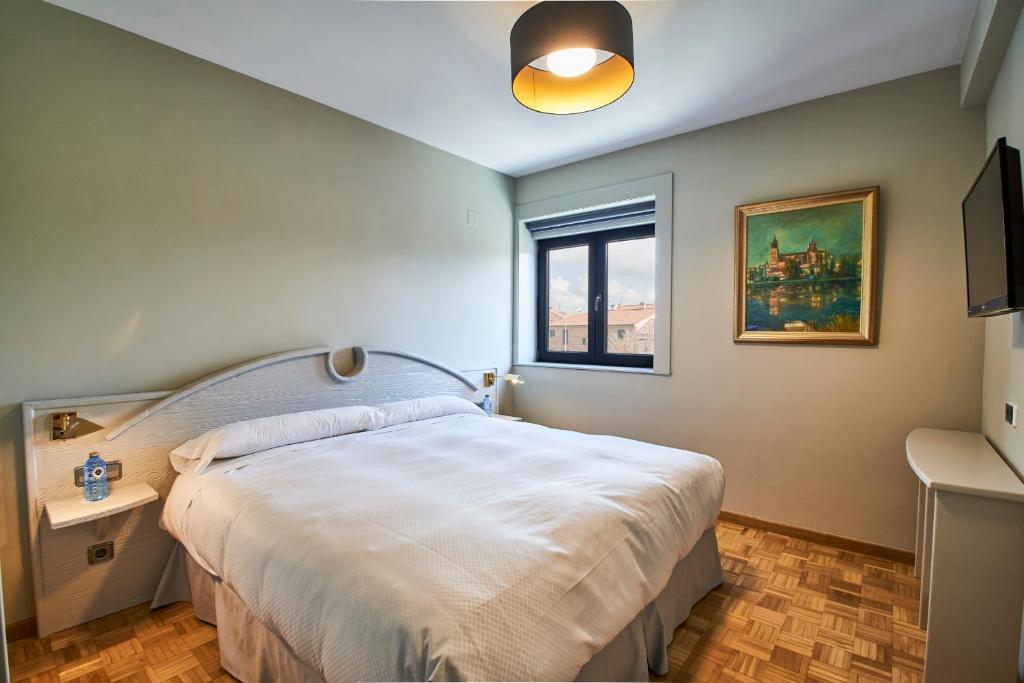 A bed or beds in a room at Sotopalacio HSR