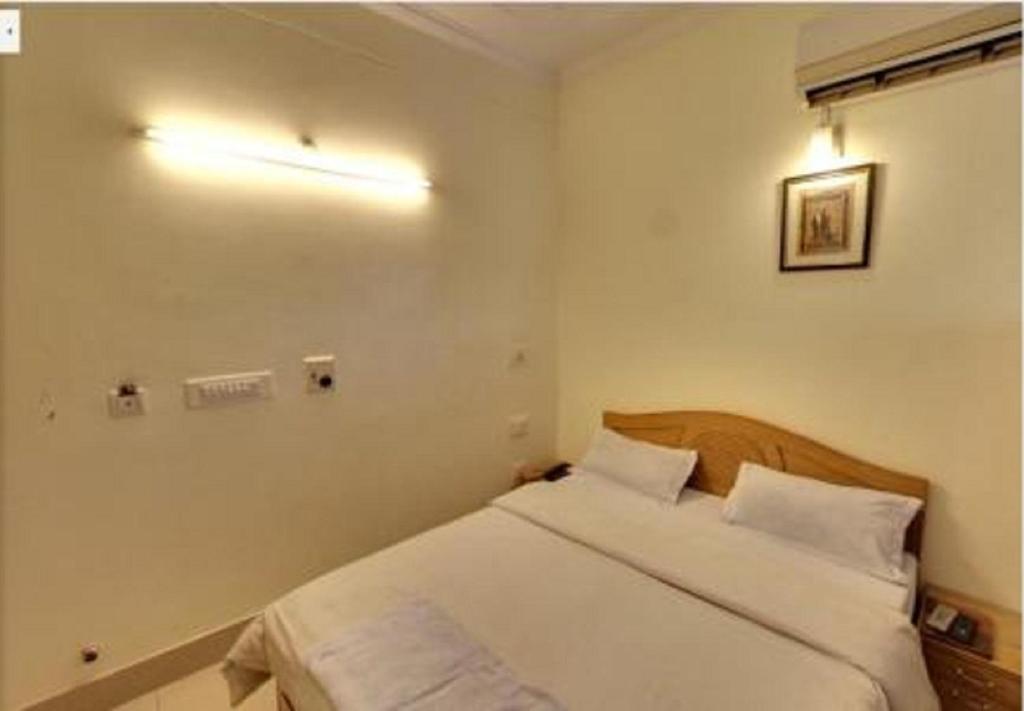 Postel nebo postele na pokoji v ubytování Hotel Landmark