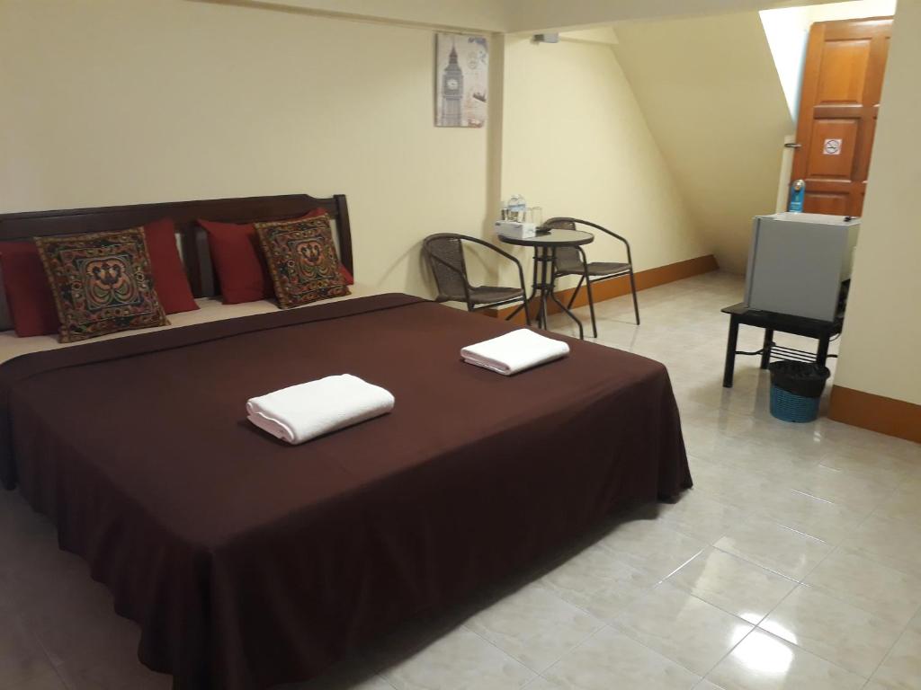 Postel nebo postele na pokoji v ubytování Relax Inn