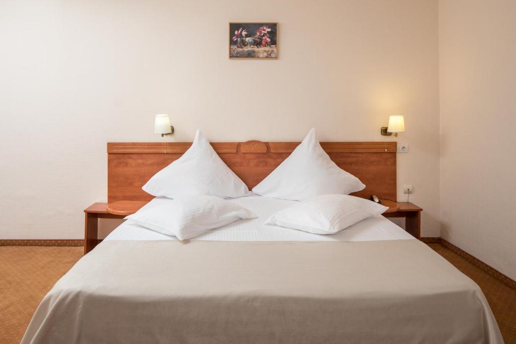 Postel nebo postele na pokoji v ubytování Hotel Rozmarin