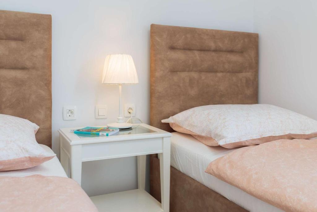 Postel nebo postele na pokoji v ubytování Villa Didovi Dvori