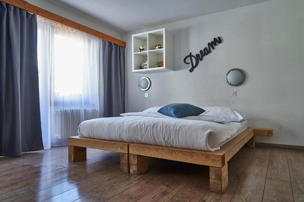 Postel nebo postele na pokoji v ubytování Hotel Marmotte