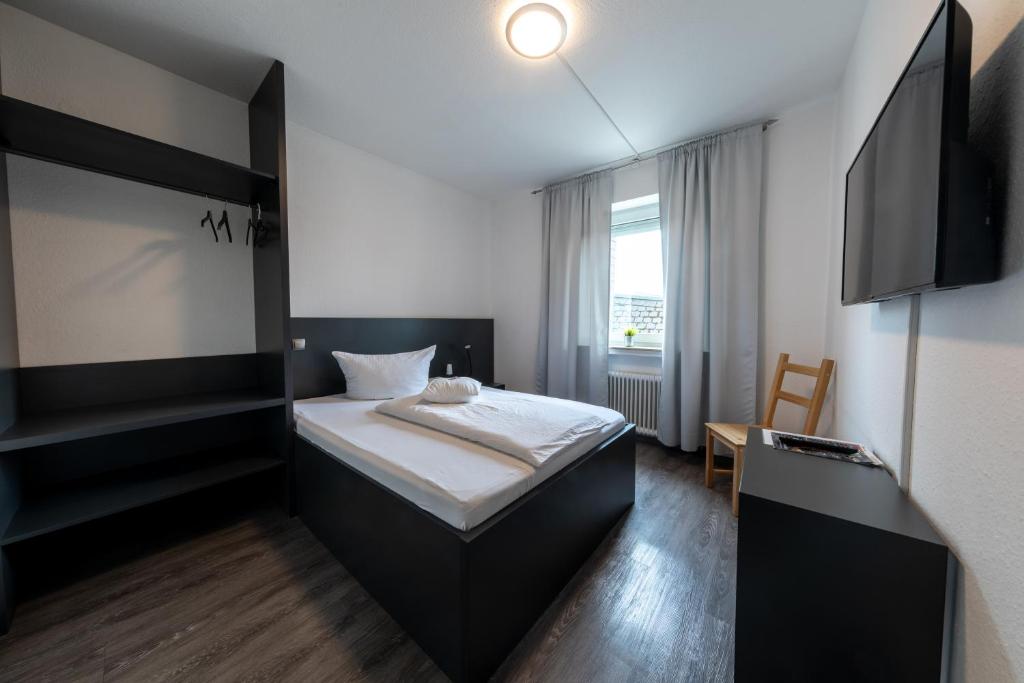 Postel nebo postele na pokoji v ubytování Hotel Central