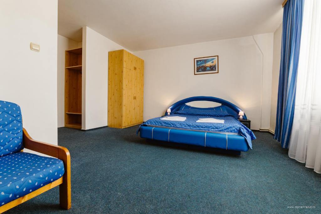 Postel nebo postele na pokoji v ubytování Hotel Iris