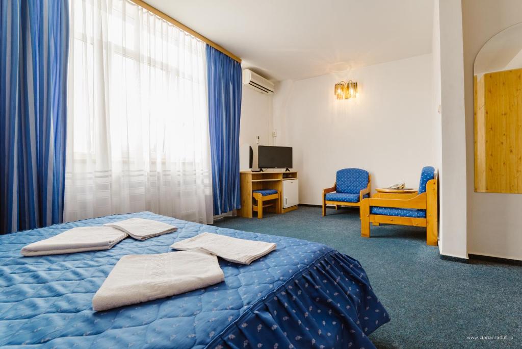 Postel nebo postele na pokoji v ubytování Hotel Iris
