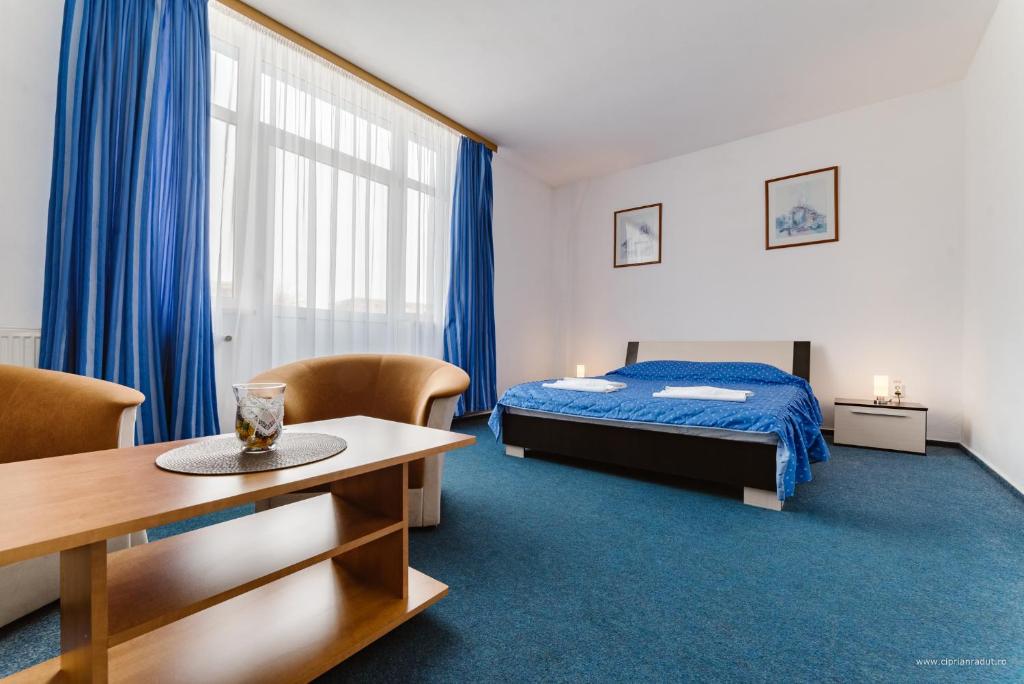 Postel nebo postele na pokoji v ubytování Hotel Iris