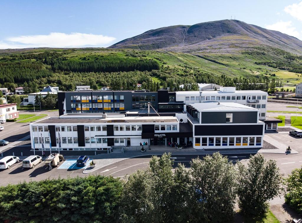 an aerial view of a building with a parking lot at Fosshotel Husavik in Húsavík