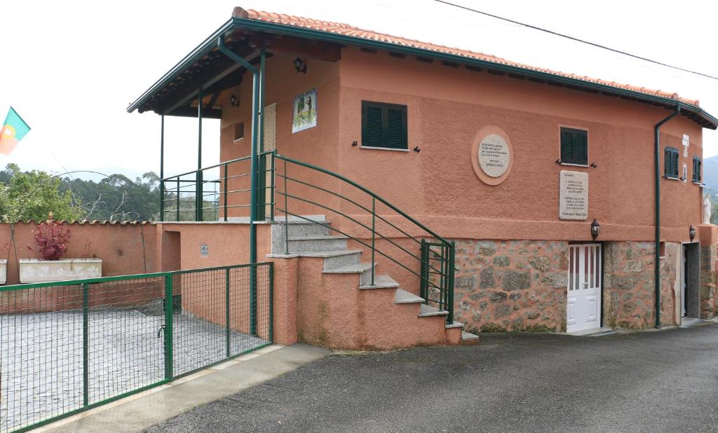 a building with a staircase on the side of it at Vivenda Agostinho (Casa de Férias) in Arcos de Valdevez