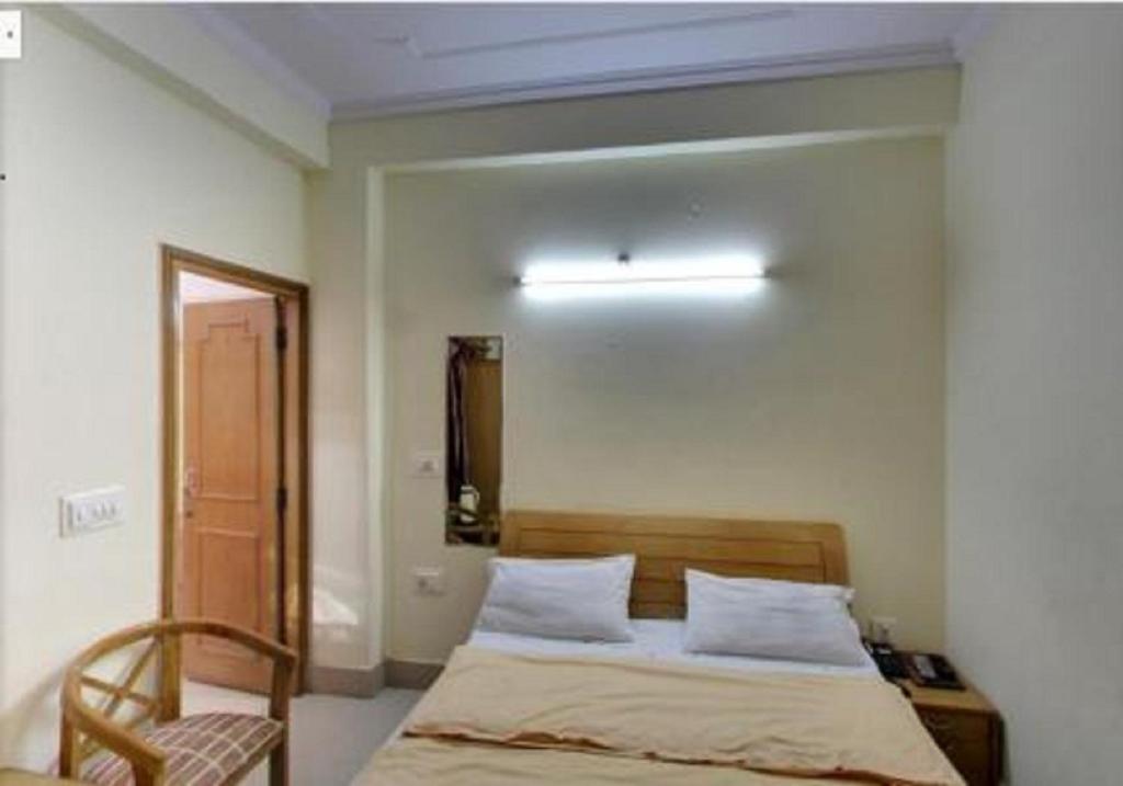 Postel nebo postele na pokoji v ubytování Hotel Landmark