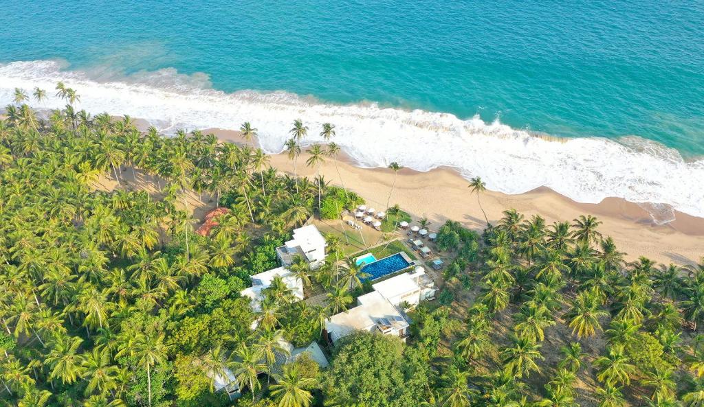 an aerial view of a resort and the beach at Lankavatara Ocean Retreat & Spa in Tangalle