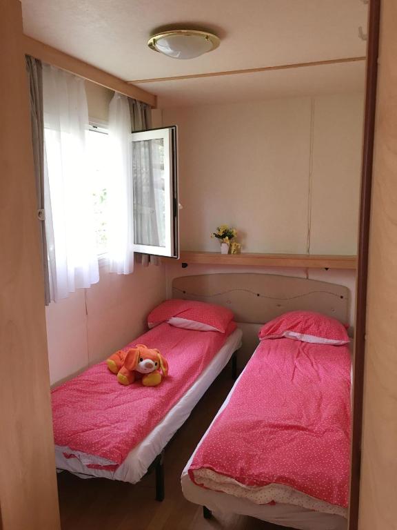 Postel nebo postele na pokoji v ubytování Camping San Giusto
