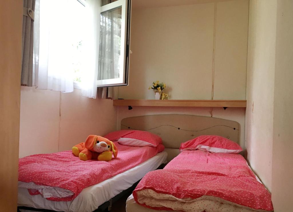 Postel nebo postele na pokoji v ubytování Camping San Giusto