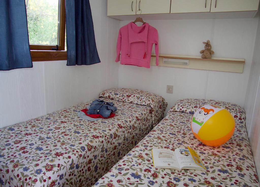 Postel nebo postele na pokoji v ubytování Camping San Giusto