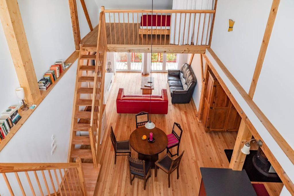 an overhead view of a living room with a staircase at Roger`s Ferienwohnung in Dießen am Ammersee