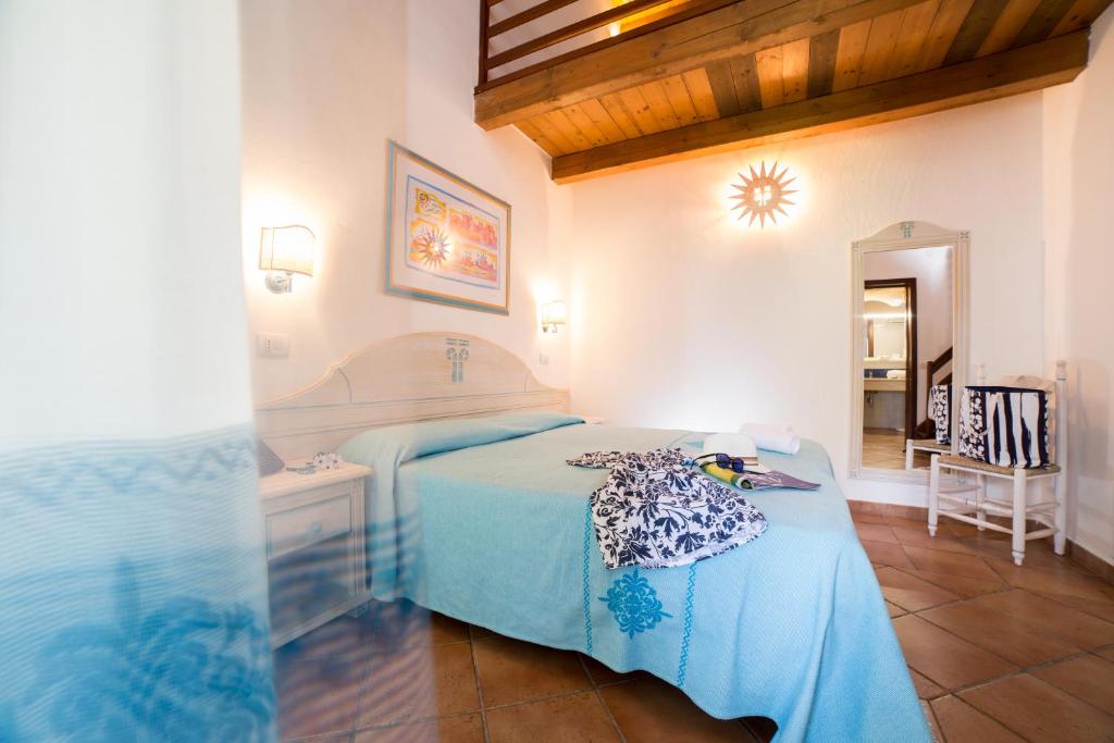Postel nebo postele na pokoji v ubytování TH San Teodoro - Liscia Eldi Village